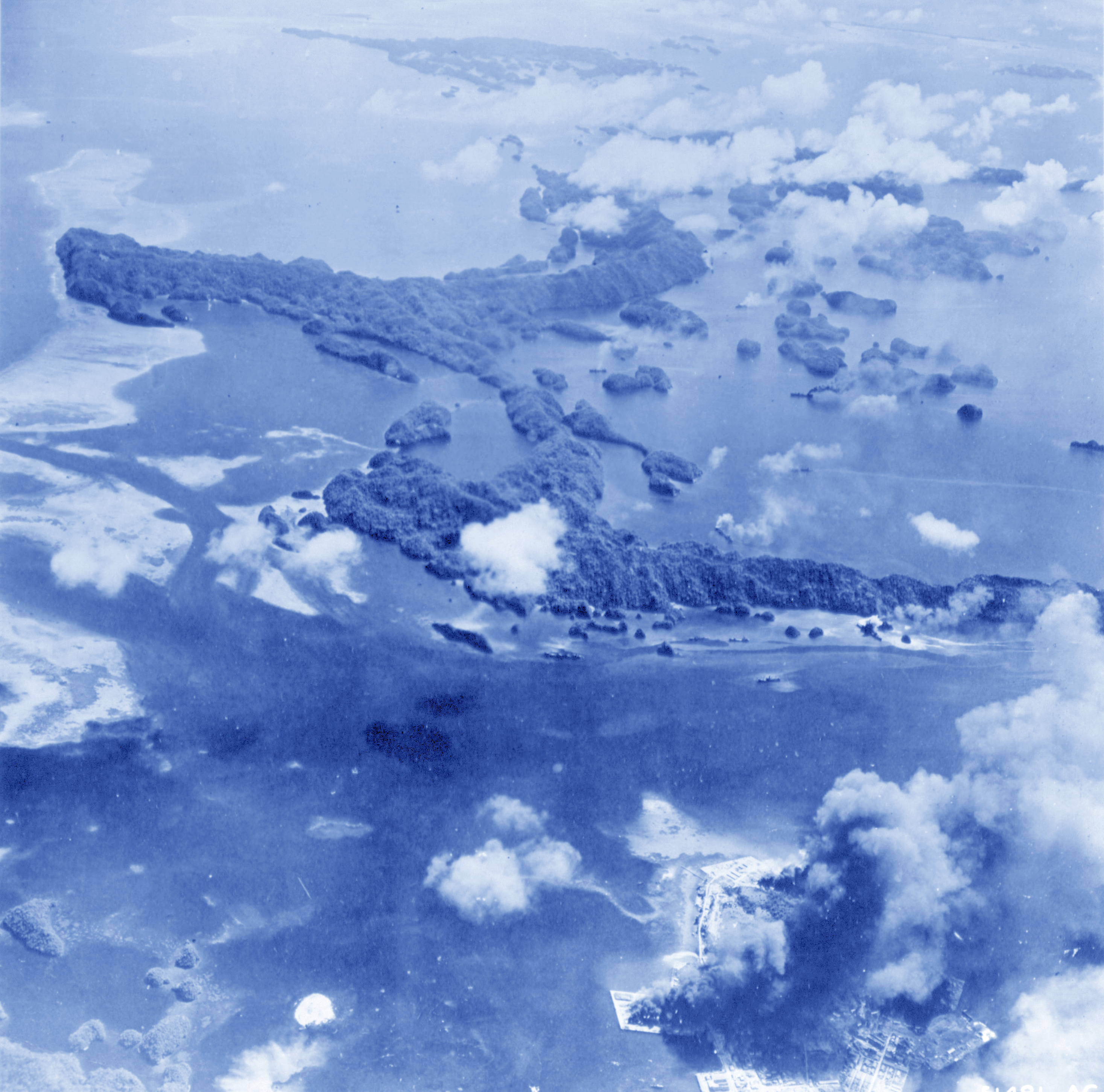 USN Target Palau Island hitting numerous buildings and ships 30th Mar 1944 NA088