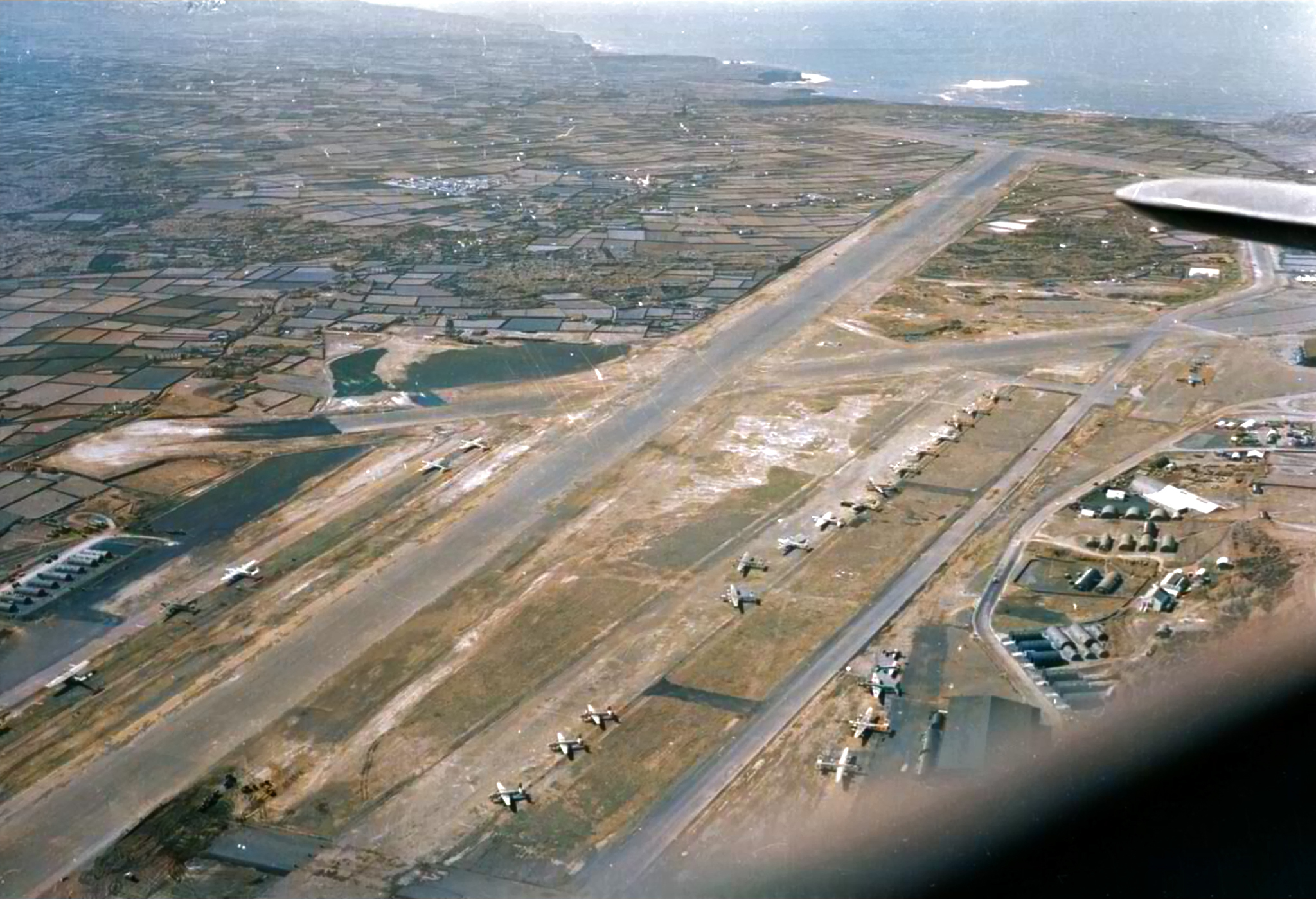 Aerial view of the airfield at Lagens showing aircraft of Coastal Command based including USAAF ferry aircraft headed to North Africa 01