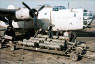 Asisbiz FMS Liberator GRV RAF 53Sqn Armourers about to load the 250lb depth charges from bomb trolleys based at St Eval Cornwall 1944 IWM CH12373