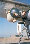 Asisbiz FMS Liberator GRV RAF ground crew member cleaning the plexiglass covering of a Leigh Light based at St Eval Cornwall 1944 IWM CH13997