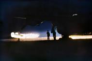 Asisbiz FMS Liberator GRV RAF ground crew member testing the power of a Leigh Light based at St Eval Cornwall 1944 IWM 01