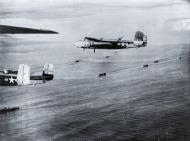 Asisbiz 41 12971 B 25C Mitchell 5AF 345BG499BS Air Apaches Dirty Dora over Cape Gloucester 25th Dec 1943 01