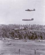 Asisbiz 41 30075 B 25D Mitchell 5AF 345BG500BS Air Apaches Lil De Icer over Boram airfield Wewak New Guinea 4th Jan 1944 03