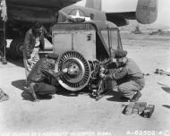 Asisbiz 41 12492 B 25C Mitchell 10AF gives shade as crew assemble a new helicopterat Singkalling Burma 23rd Jan 1945 NA009