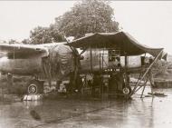 Asisbiz B 25 Mitchell under going repairs during a monsoon downpour 12th Oct 1944 01