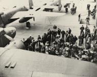 Asisbiz USAAF aircrewmen preparing .50 caliber machine gun ammunition on the flight deck of USS Hornet (CV 8) April 1942 NH53423