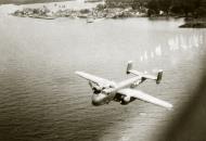 Asisbiz 44 30262 B 25J Mitchell 13AF strafing attack on the Seaplane anchorage at Victoria Harbor N Borneo 11 June 1945 01