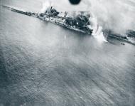 Asisbiz Target Japanese Oil Refinery at Koyagi Shima is hit by 5AF B 25 Mitchells 31st July 1945 NA386