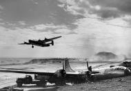Asisbiz 44 69703 Boeing B-29 Superfortress 20AF 19BG30BS A landed at Iwo Jima due to battle damage over Tokyo 10th Mar 1945 02