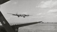 Asisbiz Boeing B-29 Superfortress 20AF 9BG1BS God's Will landing at Iwo Jima after a raid on Tokyo 10th Mar 1945 01