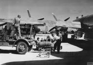 Asisbiz Boeing B-29 Superfortress 20AF ground personnel preparing to load 500lb onto a Boeing B-29 at Saipan FRE11921
