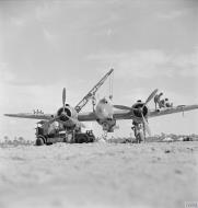 Asisbiz Beaufighter IC RAF 252Sqn U T4982 is secured in its flying position by a crane at Idku Egypt IWM CM4414