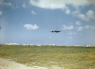 Asisbiz Bristol Beaufighter IF RAF 272Sqn circles a desert airfield Libya IWM TR860