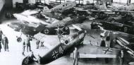 Asisbiz Various Messerschmitt Bf 109D1 crammed into a hangar Jet Prop 01