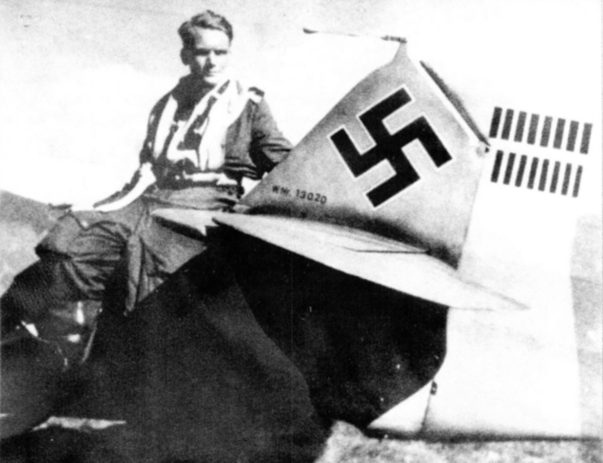 Aircrew Luftwaffe JG2 ace Julius Meimberg seats on the tail of his aircraft WNr 13020 North Africa 01