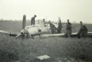 Asisbiz Messerschmitt Bf 109E3 6.JG26 Brown 1 being inspected by German ground forces after belly landing 1940 01