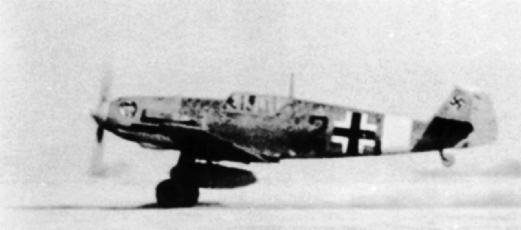 Messerschmitt Bf 109E7Trop 2.JG27 Black 2 taking off Libya 1941 01