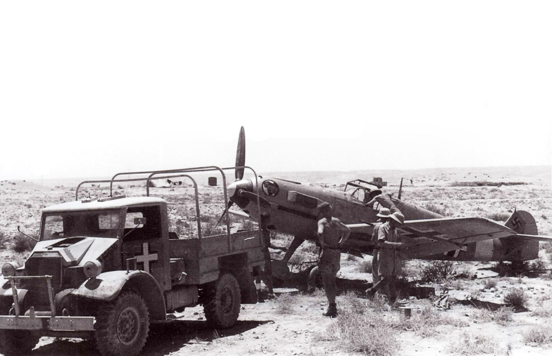 Messerschmitt Bf 109E7Trop I.JG27 being supplied by a captured Chevrolet C8 CMP Avions 190 P29