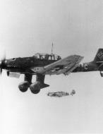 Asisbiz Messerschmitt Bf 109E7Trop Stab I.JG27 Chevron A Ludwig Franzisket escort Ju 87 Stukas II.SG2 02