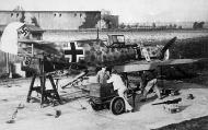 Asisbiz Messerschmitt Bf 109E ErgGr JG51 machine jacked up ready for weapons calibration check 01