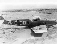 Asisbiz Messerschmitt Bf 109E7BTrop 7.ZG1 S9+DR sd during a strafing attack at Fuka Egypt 1942 02