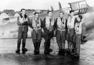 Asisbiz Aircrew Luftwaffe JG3 pilots stand in front of Bf 109G6 5.JG3 Black 6 and Black 5 foreground 01