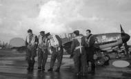 Asisbiz Aircrew Luftwaffe JG3 pilots stand in front of Bf 109G6 5.JG3 Black 6 and Black 5 foreground ebay1