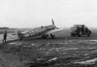 Asisbiz Messerschmitt Bf 109G6R3 JG3 Black 6 being towed out of the mud 01