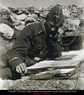 Asisbiz Aircrew Luftwaffe JG52 ace Walter Wolfrum receiving orders over the field telephone Crimea