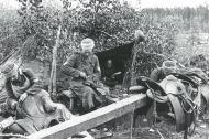 Asisbiz ROA troops fixing boots and saddles late 1943 Bunderarchiv