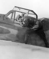 Asisbiz Aircrew Luftwaffe RVT pilot unknown unit with his Bf 109G6R3 Erla 01