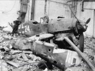 Asisbiz Messerschmitt Bf 109K4 JG27 White 24 bomb damaged Germany 1944 45 01