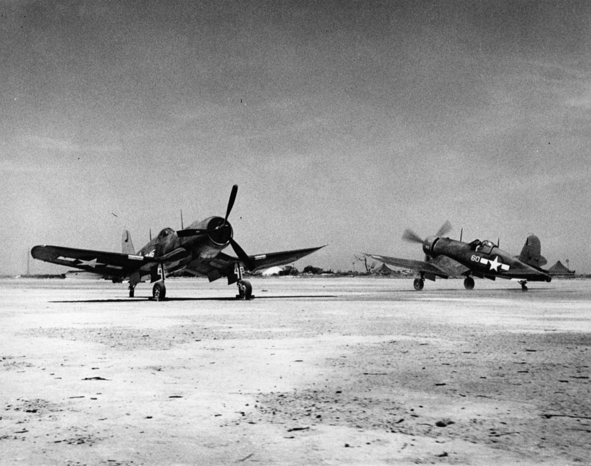 Vought F4U-1A Corsair VMF-113 White 45 and 60 on the ground on Engebi Island Pacific 1945 01