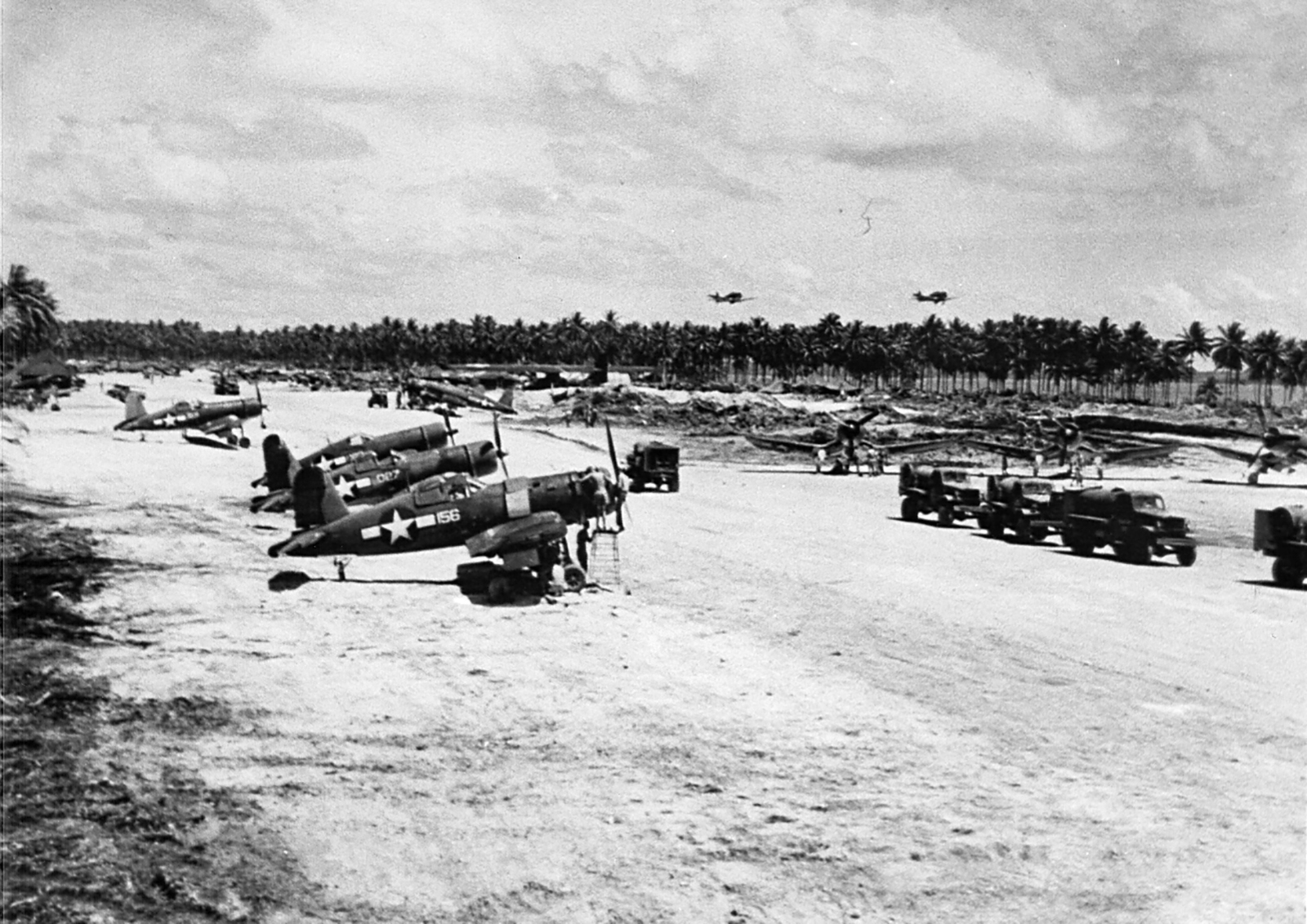 Vought F4U-1A Corsairs VMF-211 White 156 and 027 on the ground at Green Island 1944 01