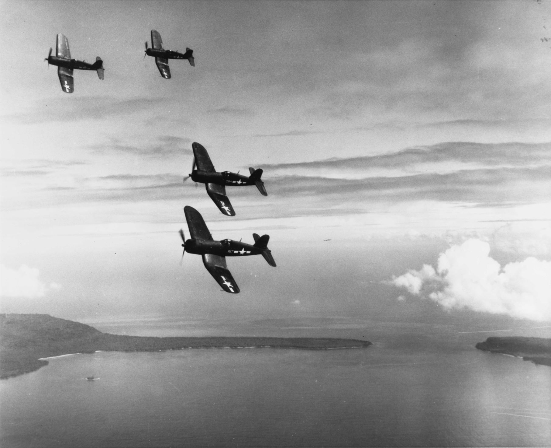Vought F4U-1A Corsairs White 917 and 094 flying in formation over the picturesque Soliman Islands 18th Mar 1944 01