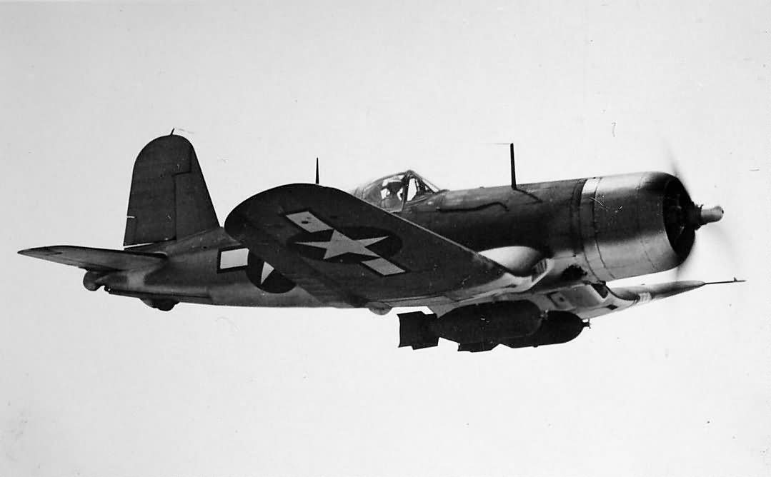 Vought F4U-1D Corsair carring two 1000 pound bombs and in the three tone paint scheme 01