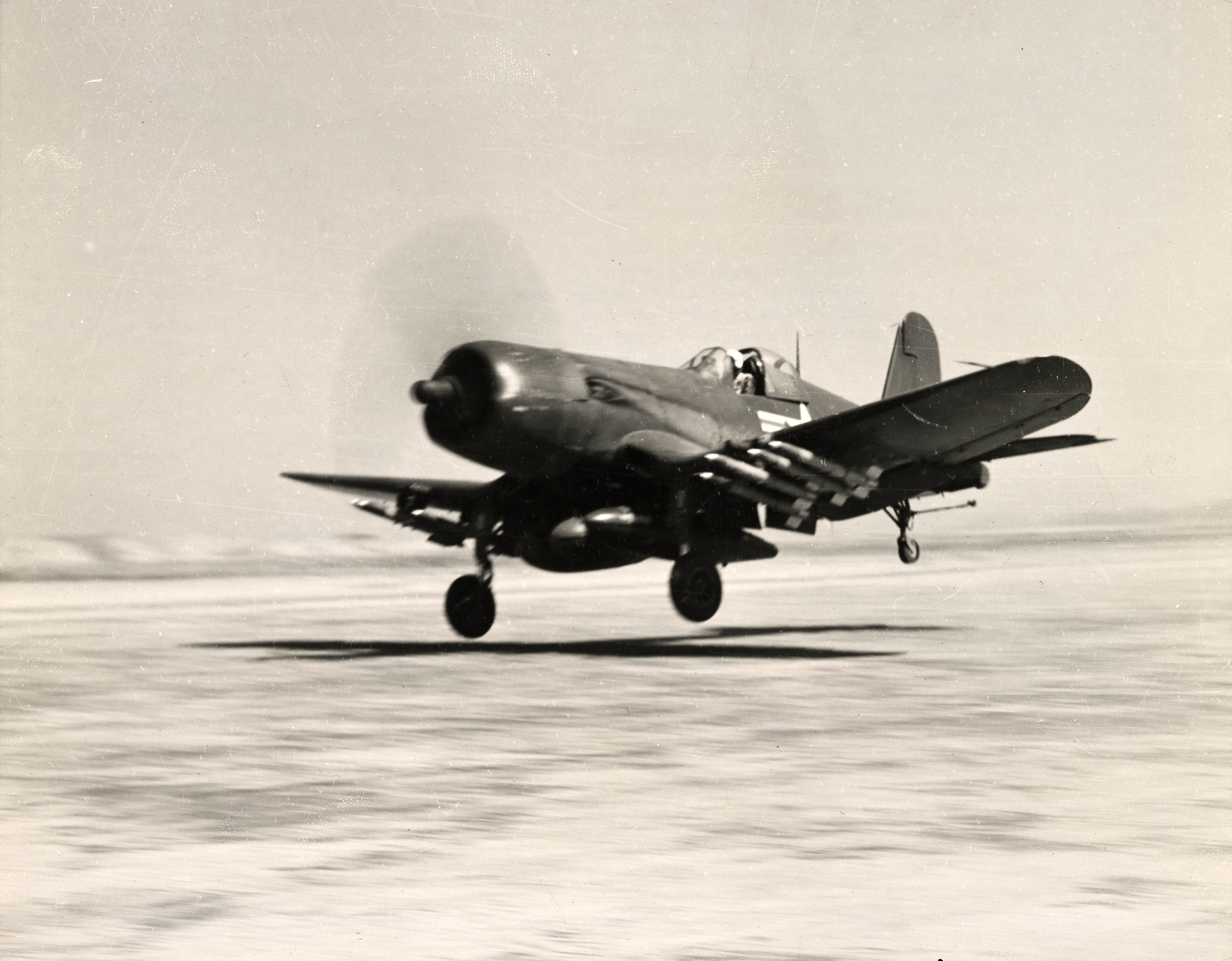 Vought F4U-5D Corsair 1MAW carrying Napalm and rockets takes off from a forward airbase in Korea c1950 01
