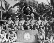 Asisbiz Aircrew USMC VMF 112 Wolfpack pilots pose for a photo showing their score sheet 01