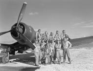 Asisbiz Vought F4U 1D Corsair VMF 113 White 44 and the groups pilots pose for a photo Engebi Island 1944 01