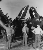 Asisbiz Vought F4U 4B fighter is fueled and armed with 5 inch rockets aboard USS Valley Forge (CV 45) Korean east coast 19th July 1950