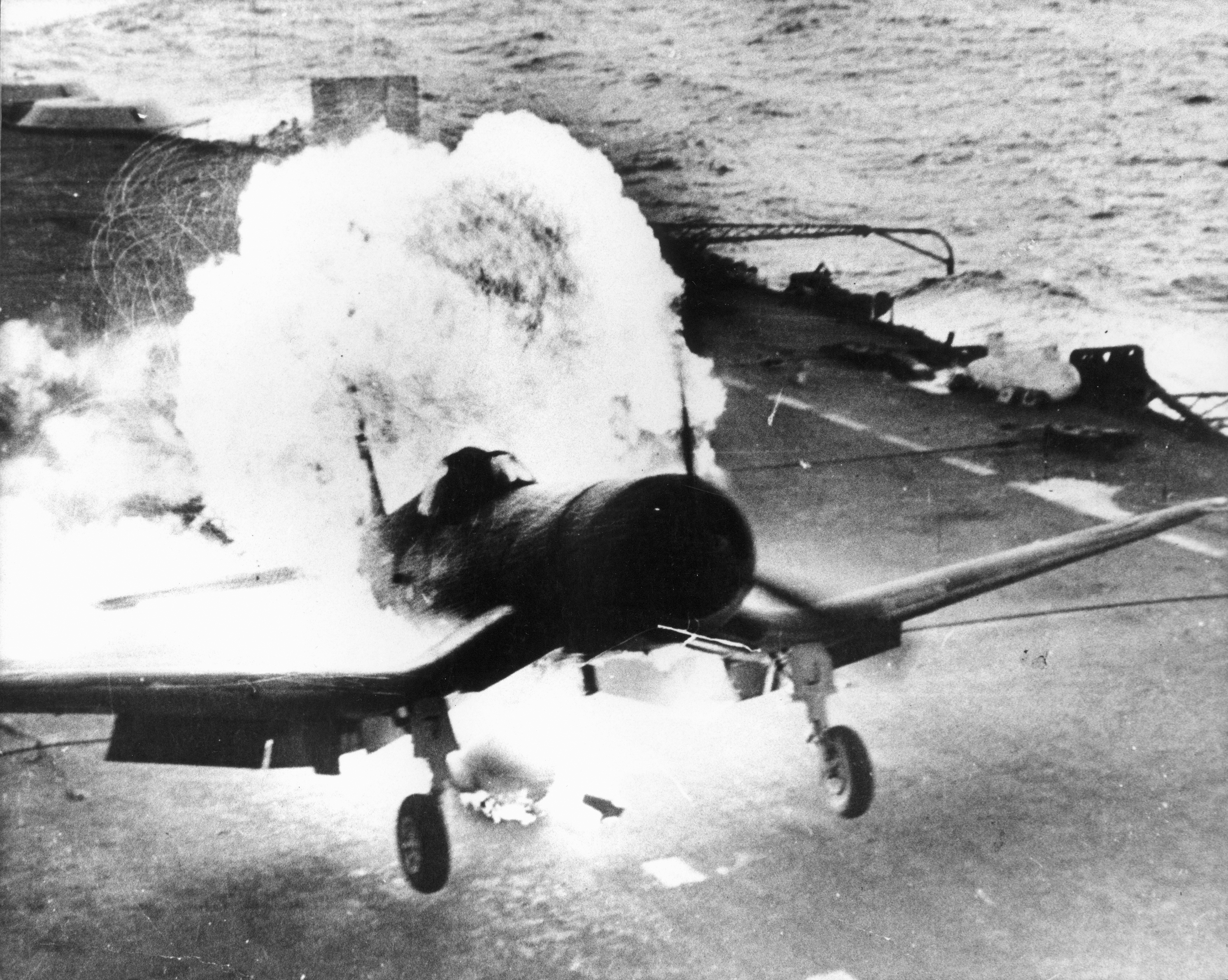 Fleet Air Arm Corsair landing on HMS Victorious in a fire ball after the drop tank ignited 01