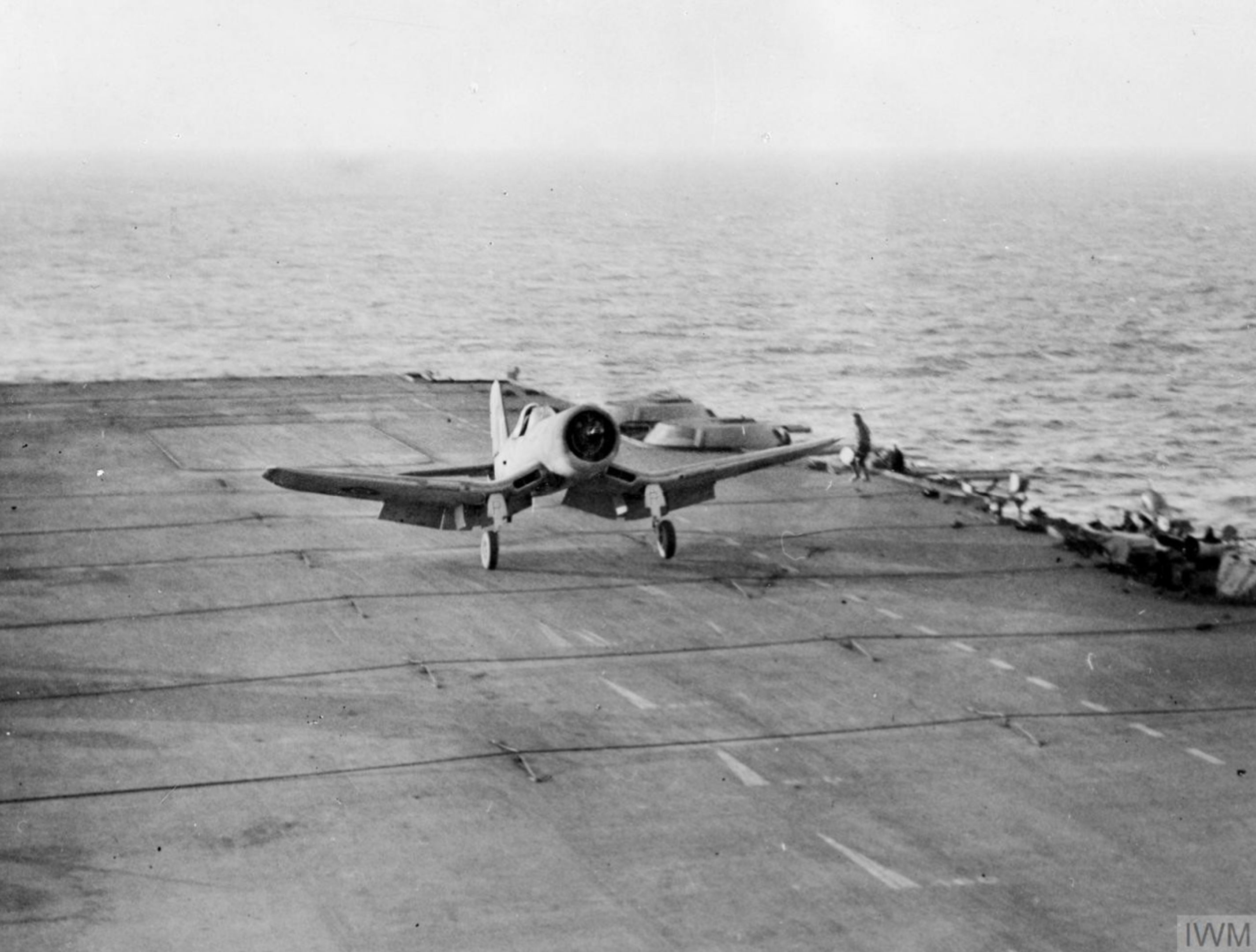 Fleet Air Arm 1830NAS Corsair II Red 7R landing aboard HMS Illustrious Dec 1943 IWM A20998