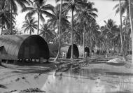 Asisbiz RNZAF 6Sqn Quonset (Nissen) huts nestled among the palm trees Segond Channel Espiritu Santo 01