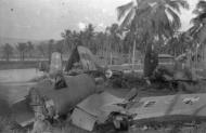 Asisbiz RNZAF Corsair airframes with a lone P 40 abandoned at a Pacific scrapyard 01