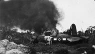 Asisbiz RNZAF Firemen helping a Corsair pilot after crashing off the runway at Bougainville 01