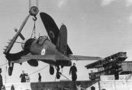 Asisbiz Vought F4U 1A Corsair RNZAF NZ5643 being craned ashore from HMS Glory at Iwakuni Japan 01