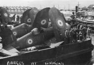 Asisbiz Vought F4U 1A Corsair RNZAF NZ5653 being taken ashore from HMS Glory at Iwakuni Japan 01