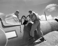 Asisbiz Vought F4U 1D Corsair RNZAF 14Sqn pilot climbing into the cockpit at Piva Bougainville 01