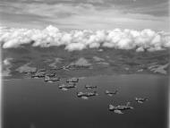 Asisbiz Vought F4U 1D Corsair RNZAF 18Sqn in formation over the ocean near Guadalcanal 01