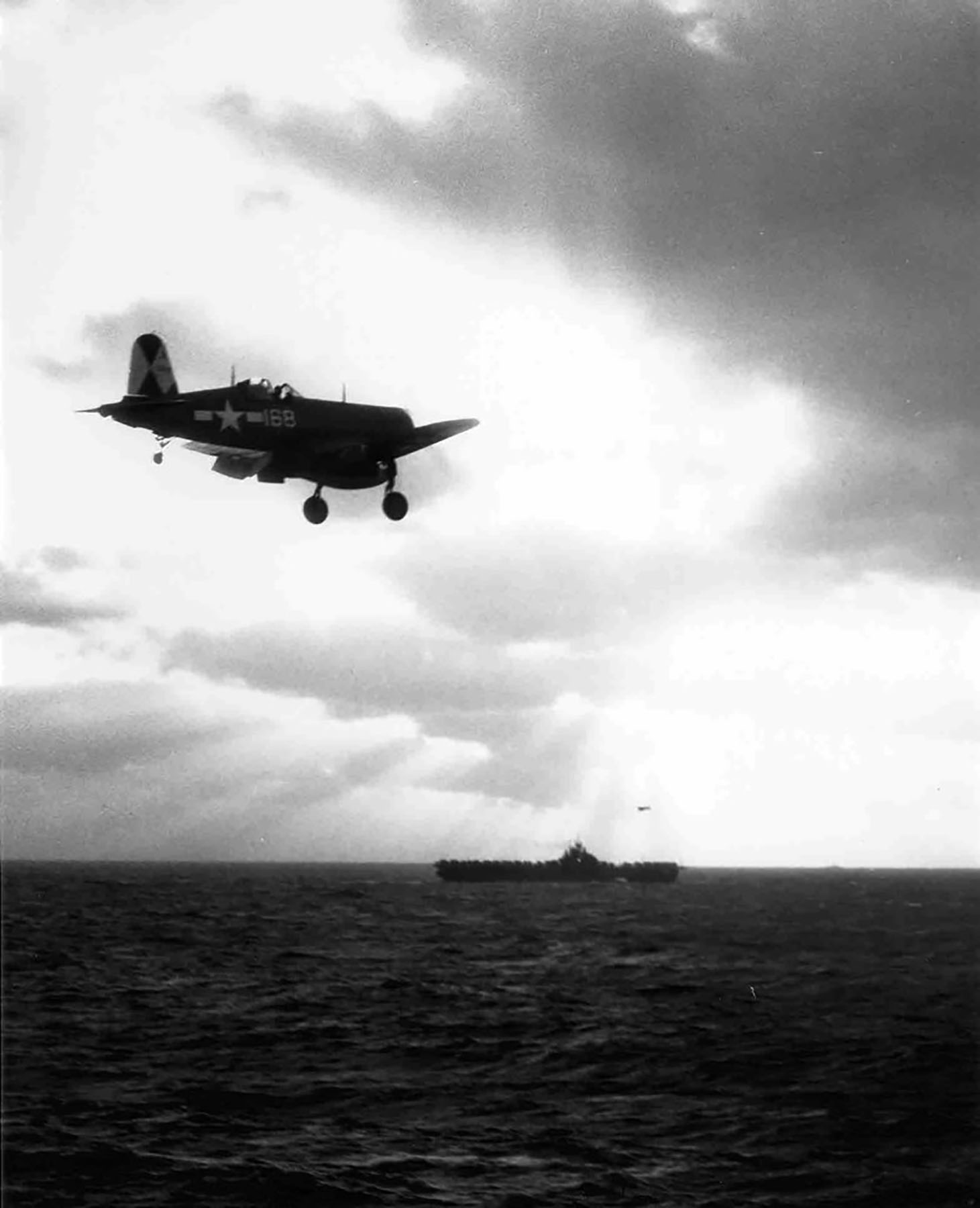 Vought F4U 1D Corsairs VBF 83 White 168 circling to land on CV 9 USS Essex 1945 01